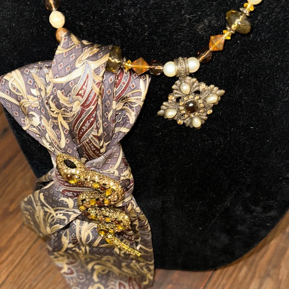 Elegant Paisley Silk Tie with Gold rhinestone snake on beaded necklace.